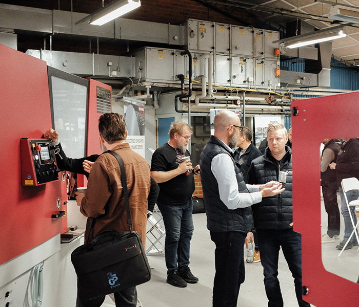 People around saws at Metal Cutting event 2024